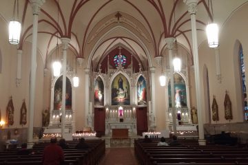 After the climb, the faithful sit and pray in silence inside Holy Cross Immaculata Church. (Greg Hartman/CT Photo)