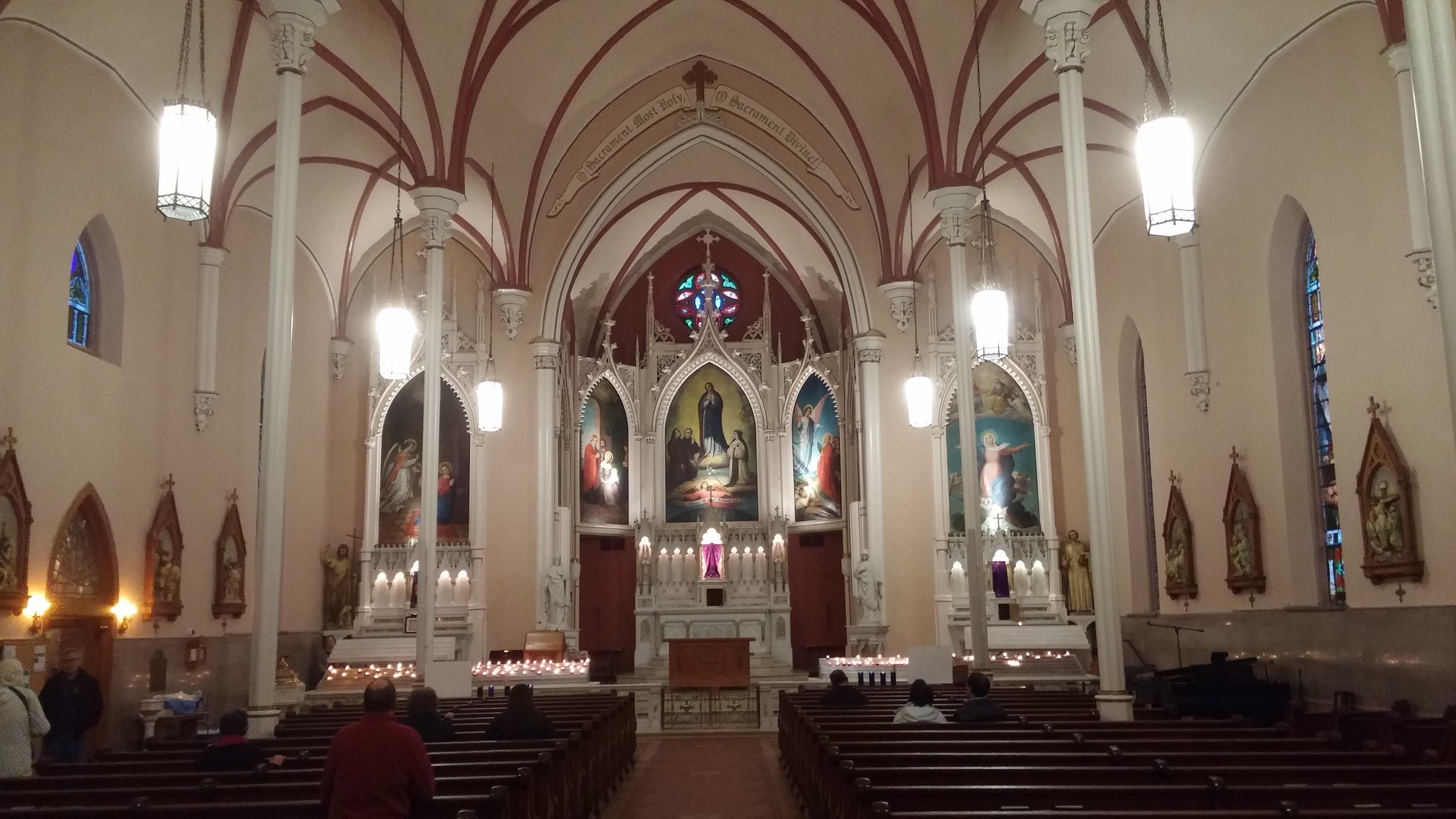 After the climb, the faithful sit and pray in silence inside Holy Cross Immaculata Church. (Greg Hartman/CT Photo)