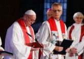 Pope Francis attends an ecumenical prayer service at the Lutheran cathedral in Lund, Sweden, Oct. 31. Also pictured are the Rev. Martin Junge, general secretary of the Lutheran World Federation, and Archbishop Antje Jackelen, primate of the Lutheran Church in Sweden. The pope made a two-day visit to Sweden to attend events marking the 500th anniversary of the Protestant Reformation. (CNS photo/Paul Haring)