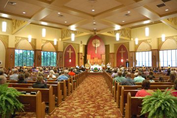 Schoenstatt Leader, Susan Bernhold addresses the congregation prior to holy mass. (Jeff Unroe/CT Photo)