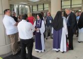 Local Children of Mary Sisters meet others waiting for the Eucharistic procession to begin (CT Photo/Gail Finke)