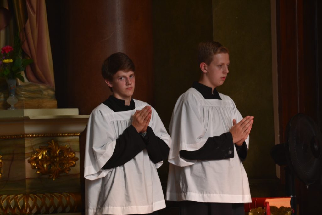 Alter boys await the gifts during the 17th Anniversary Mass at Old St. Mary's. (CT Photo/Greg Hartman)