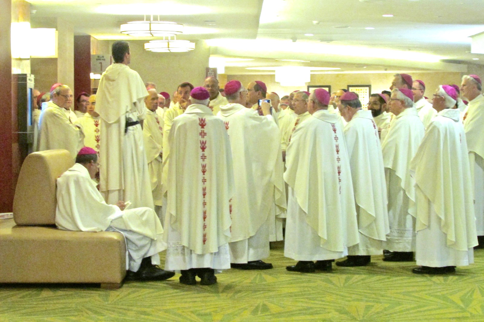 A Dominican addresses dozens of bishops waiting for Mass to begin (CT Photo/Gail Finke