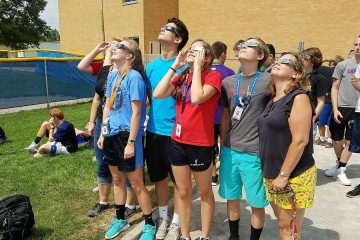 Carroll High School Students in Dayton looking at partial eclipse 2017 (Courtesy Photo)