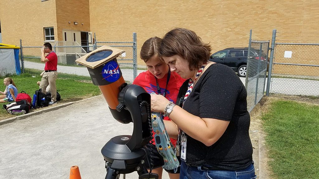 Carroll High School students enjoy a high powered telescope for the eclipse. (Courtesy Photo)
