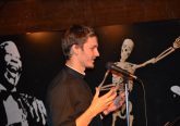 Though it was a stage usually reserved for comics and bands, Seminarian Chris Komoroski delivers his talk on The Power of Silence. (CT Photo/Greg Hartman)