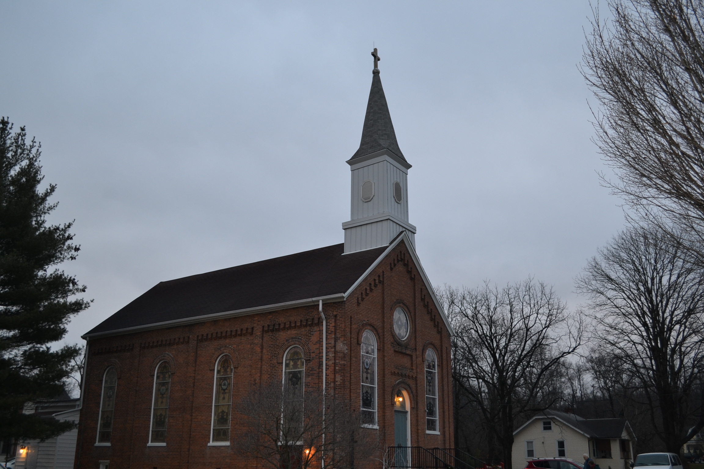 Known as the little church, parishioners arrive at St. Jerome at dusk (CT Photo/Greg Hartman)