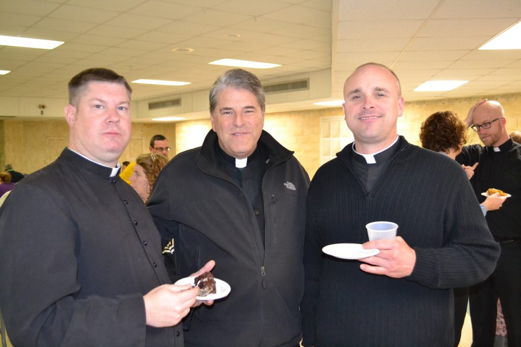 From left to right, Father Thomas McCarthy, Father Tom Wray, and Father Jason Bedel at the viewing party. (CT Photo/Greg Hartman)