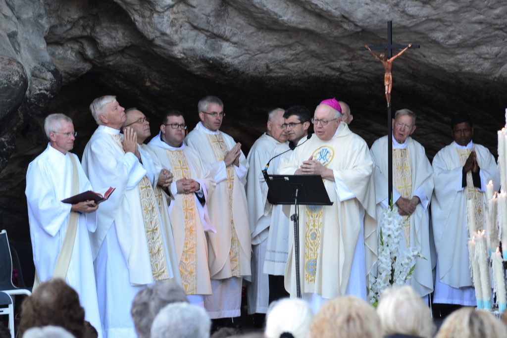 Bishop Binzer celebrates Mass at the Grotto in Lourdes France (CT Photo/Greg Hartman)