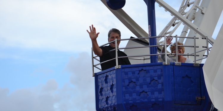 Father Tom Wray and his wife Janet on a Ferris Wheel in Barcelona Spain at the mountain of Tibidabo (CT Photo/Greg Hartman)