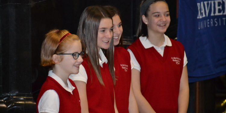 Students from St. James the Greater awaiting the Catholic Schools Week Mass. (CT Photo/Greg Hartman)