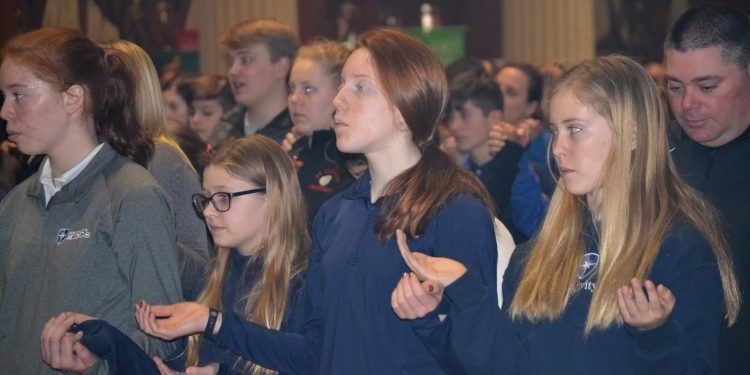 Praying at Mass a strong part of a Catholic Schools Education. (CT Photo/Greg Hartman)