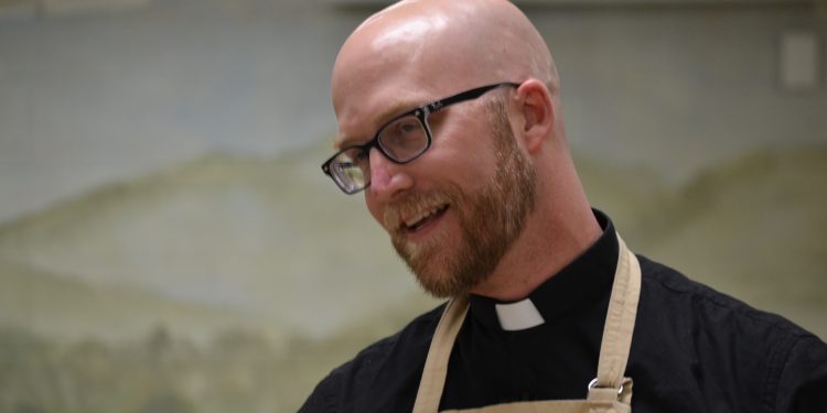 Father Kyle Schnippel during the "cook off" at St. John Neumann Parish (CT Photo/Greg Hartman)