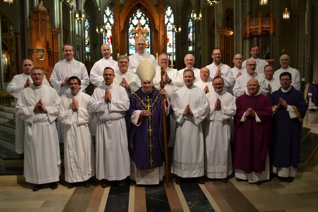 Row 1 (L to R): Steve Broering, Peter Caccavari, Greg Doud, Bishop Foys, Graham Galloway, Nathan Beiersdorfer, Fr. Paul Keller (representing Mt. St. Mary’s Seminary), Deacon Mark Machuga (Director of the Office of the Diaconate)