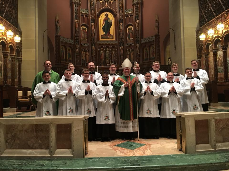 Photo Credit (l to r): Front Row: Elvis Aguilar, Charles Westerhold, Alexander Elfreich, Chibueze Asiegbulem, Archbishop Joseph E. Kurtz, Kevin LeMelle, Randolfo Lemus Arias, Michael Willig. Second Row: Father Anthony Brausch, J. Tyler Marsh, Broderick Witt, Thomas Hunyor, Jr., Robert Hale, Stephen Jones, Jacob Lindle, Ethan Hoying. (CT Photo/EL Hubbard)
