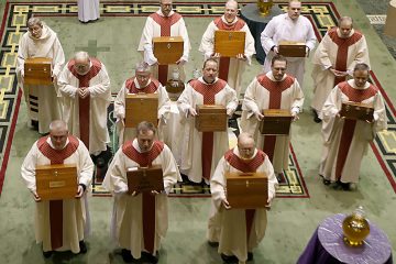 The Sacred Oils are distributed to a priest from each Deanery during the Chrism Mass at the Cathedral of Saint Peter in Chains in Cincinnati Tuesday, Mar. 27, 2018. (CT Photo/E.L. Hubbard)