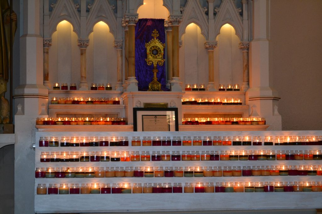 Upon entering the church, pilgrims left lit candles inn the sanctuary (CT Photo/Greg Hartman)