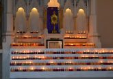 Upon entering the church, pilgrims left lit candles inn the sanctuary (CT Photo/Greg Hartman)