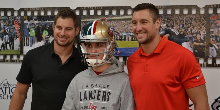 Brent & Garrett Celek pose with a Lancer, (Note the Eagle/49er helmet) (CT Photo/Greg Hartman)