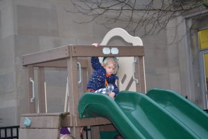 A slide is always fun in the playground on a warm for February Friday Fish Fry Night at Cardinal Pacelli School (CT Photo/Greg Hartman)