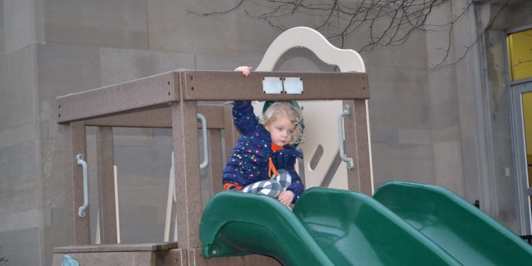 A slide is always fun in the playground on a warm for February Friday Fish Fry Night at Cardinal Pacelli School (CT Photo/Greg Hartman)