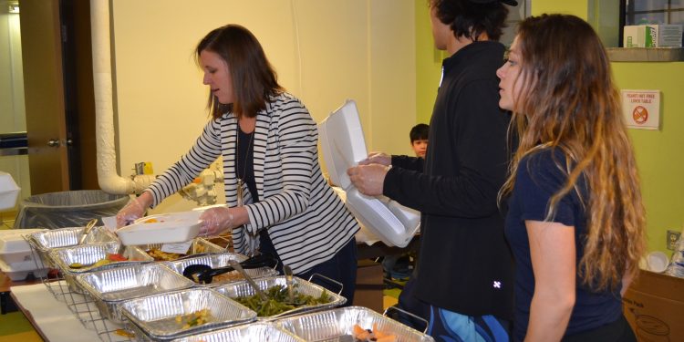 Lots to choose from for carry-out orders as workers enthusiastically feed many (CT Photo/Greg Hartman)