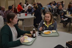 Caught! Two young women having fun at the St. Cecilia Fish Fry (CT Photo/Greg Hartman)