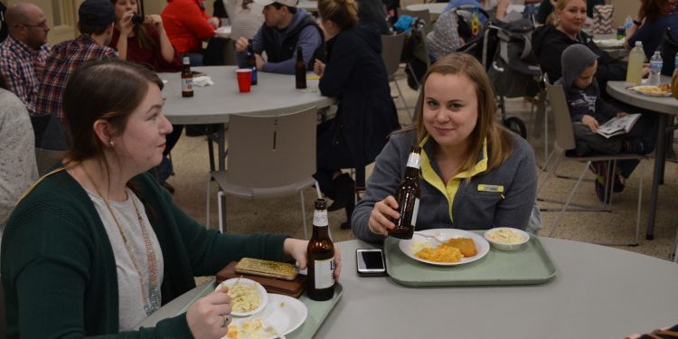 Caught! Two young women having fun at the St. Cecilia Fish Fry (CT Photo/Greg Hartman)