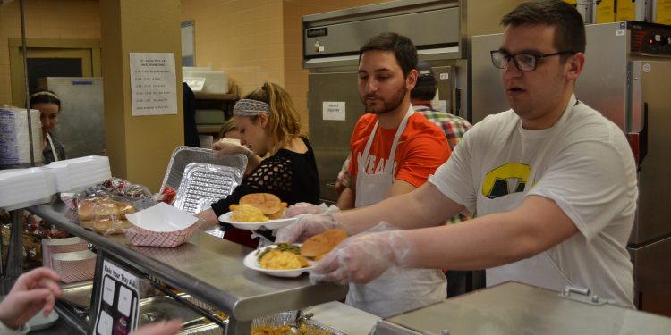 From left to right your St. Cecilia Fish Fry Crew, Sarah Rose Sperduto, fiance J.P. Bort, and Jason Hinson serve up Fish Fry delights (CT Photo/Greg Hartman)