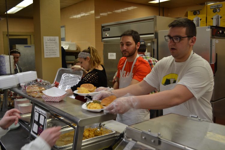 From left to right your St. Cecilia Fish Fry Crew, Sarah Rose Sperduto, fiance J.P. Bort, and Jason Hinson serve up Fish Fry delights (CT Photo/Greg Hartman)