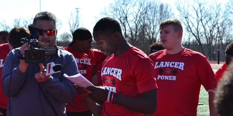 Students and coaches read each station (CT Photo/Greg Hartman)