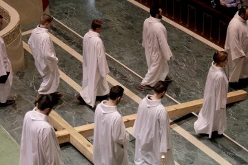 The Holy Cross lies in front of the Altar as the Choir of St. Peter in Chains Cathedral recesses during the Celebration of the Passion of the Lord at the Cathedral of St. Peter in Chains in Cincinnati on Good Friday, Mar. 30, 2018. (CT Photo/E.L. Hubbard)