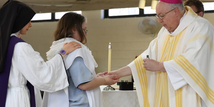 Amie King receives confirmation during Easter Mass. (CT Photo/Mark Bowen)