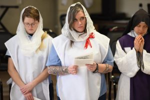 Teri and Erin during Easter Mass at Dayton Correctional Institution (CT Photo/Mark Bowen)