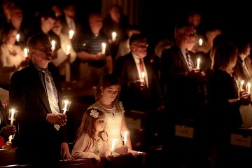 Parishioners hold candles for the Easter Vigil in the Holy Night at the Cathedral of Saint Peter in Chains in Cincinnati, Holy Saturday, March 31, 2018. (CT Photo/E.L. Hubbard)