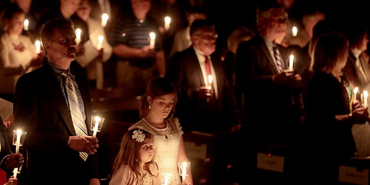Parishioners hold candles for the Easter Vigil in the Holy Night at the Cathedral of Saint Peter in Chains in Cincinnati, Holy Saturday, March 31, 2018. (CT Photo/E.L. Hubbard)