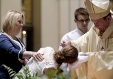Alexandra Marie Markley is baptized by Archbishop Dennis Schnurr for the Easter Vigil in the Holy Night at the Cathedral of Saint Peter in Chains in Cincinnati, Holy Saturday, March 31, 2018. (CT Photo/E.L. Hubbard)