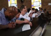 Inmates during the Eucharistic Prayer at Easter Vigil (CT Photo/Tim Uhlman)