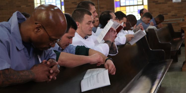 Inmates during the Eucharistic Prayer at Easter Vigil (CT Photo/Tim Uhlman)