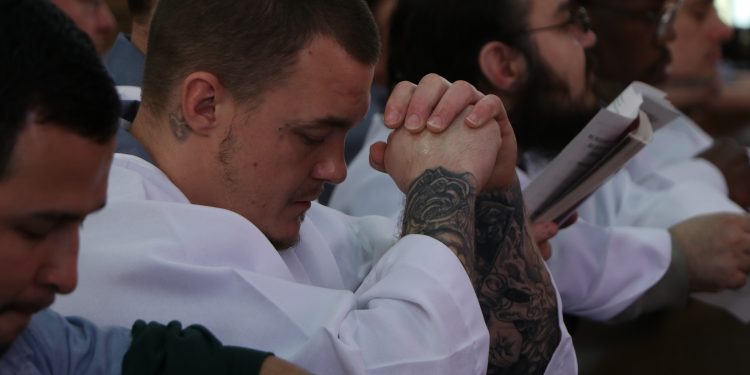 Baptism brings new life to inmates at Lebanon Correctional who were received into the church on Easter Vigil (CT Photo/Tom Uhlman)