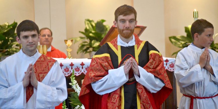 Rev. Jacob Willig awaits the gifts at St. Antoninus Parish (CT Photo/Greg Hartman)