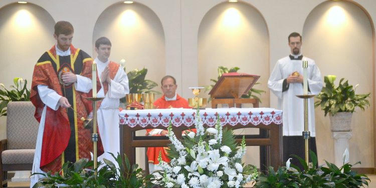 Rev. Jacob Willig censes the altar at St. Antoninus. (CT Photo/Greg Hartman)