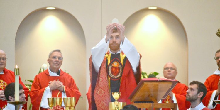 Rev. Jacob Willig during Eucharistic Prayer I "...this is my body which will be given up for you." (CT Photo/Greg Hartman)