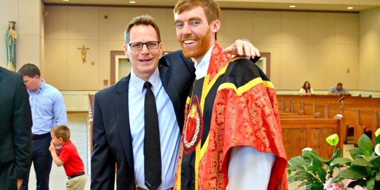 Rev. Jacob Willig with well wishers after First Mass of Thanksgiving at St. Antoninus (CT Photo/Greg Hartman)