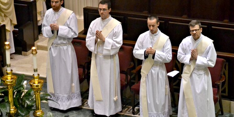 (From left to right) Deacon Jacob Willig, Deacon Andrew Smith, Deacon Jarred Kohn, Deacon Craig Best. (CT Photo/Greg Hartman)