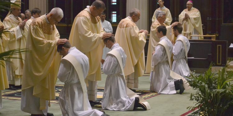 Laying on of Hands and Prayer of Ordination. (CT Photo/Greg Hartman)