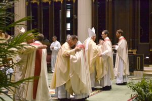 Sign of Peace,The ASrchbishop and all the concelebrating priests welcome the newly ordained into the order of presbyters. (CT Photo/Greg Hartman)