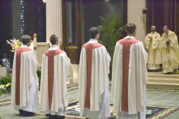 The newly ordained await their assignments (CT Photo/Greg Hartman)