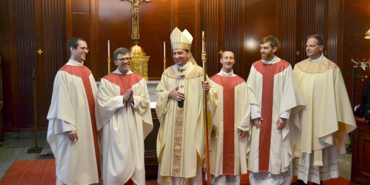 A very joyous day in the Archdiocese of Cincinnati as Archbishop Schnurr congratulates the newly ordained. (CT Photo/Greg Hartman)