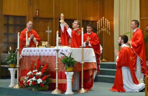 Rev. Craig Best during Eucharistic Prayer I, "When supper was ended, he took the cup. Again he gave you thanks and praise, gave the cup to his disciples,..." (CT Photo/Greg Hartman)